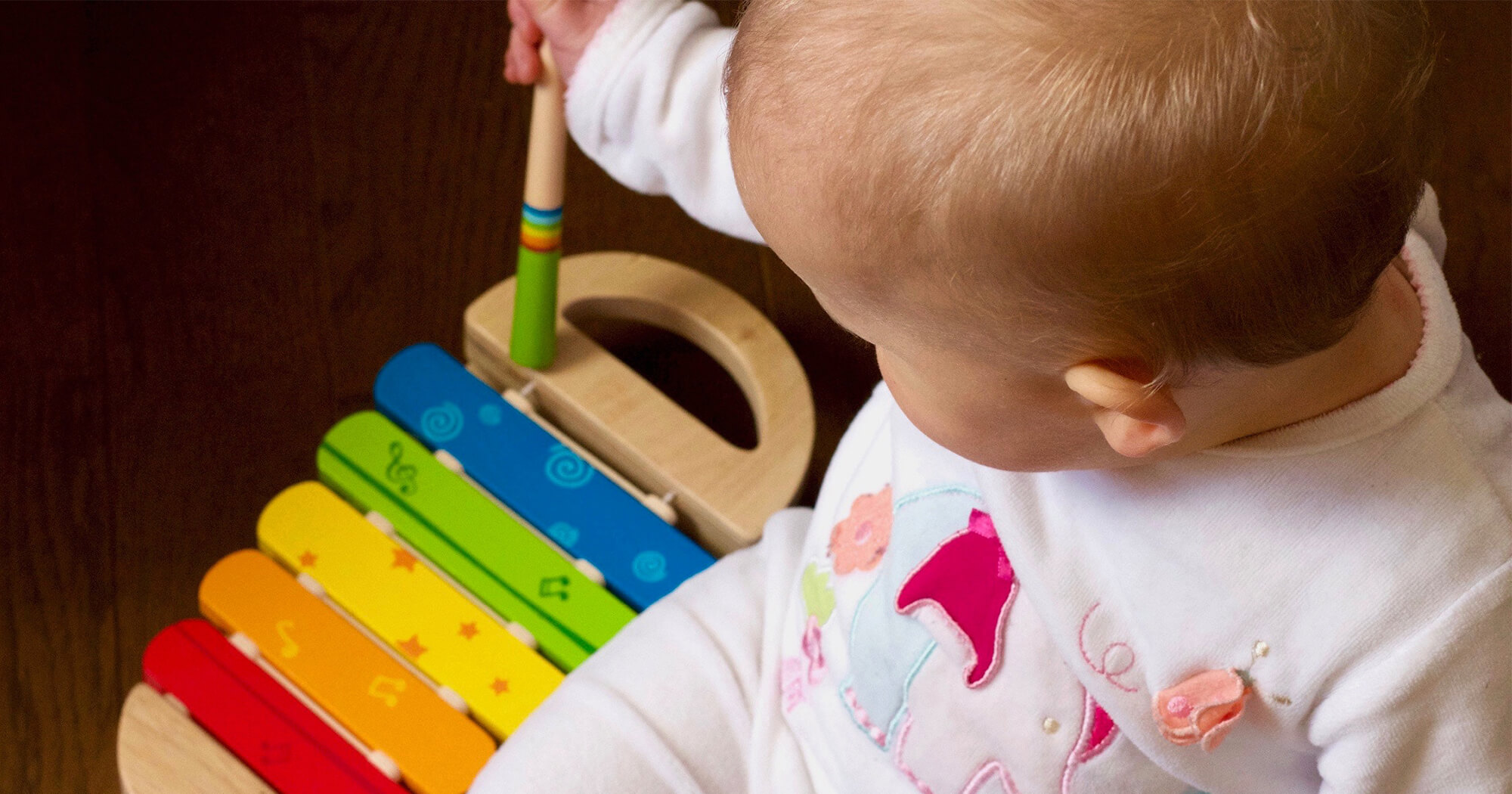baby playing with music