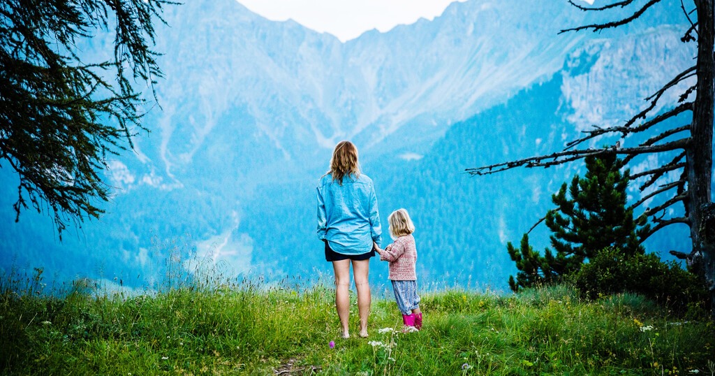 Mother and daughter exploring the mountains